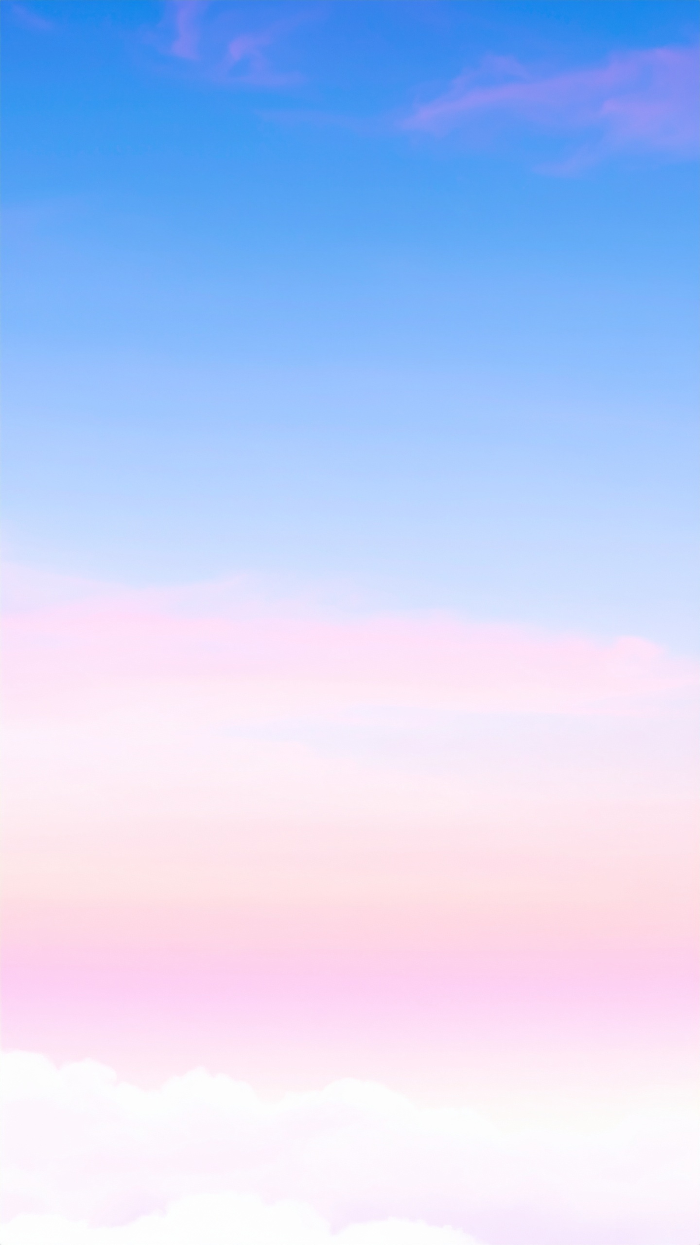 縦の淡い青とピンクの空の背景画像